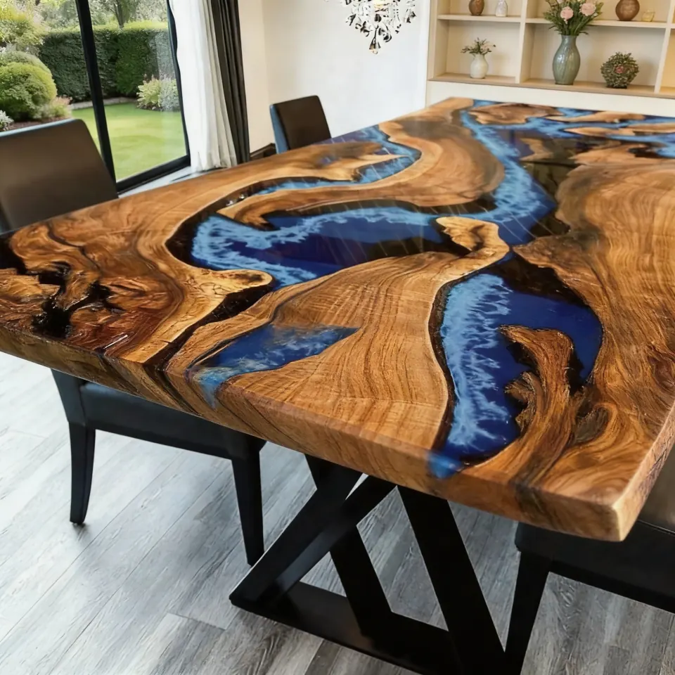 A live-edge blue epoxy river dining table in a bright room with a garden view